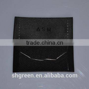 Straight Cut Black Background Black Logo Woven Label