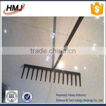 green painted rake head