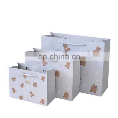 Wholesale Cheap Custom Design Classic Gift Clothing White Cardboard Shopping Paper Bag with Ribbon Handle