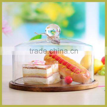 fantastic glass cake dome with wooden base