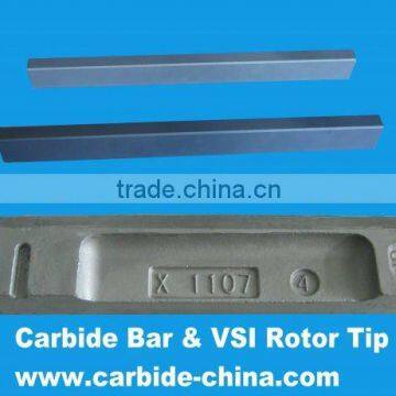 VSI rotor tip with carbide bar