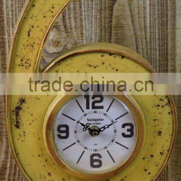 ANTIQUE YELLOW METAL VASE SHAPE TABLE TOP CLOCK