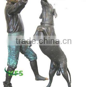 Bronze sculpture of dog biting shoe