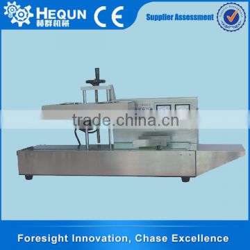 HEQUN Automatic Electromagnetism Inductor Aluminum Foil Sealing Machine