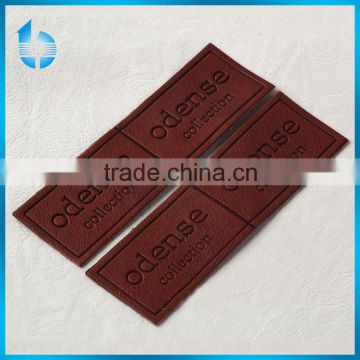 Custmized embossed leather tag produced by Alibaba credible factory ,for jeans