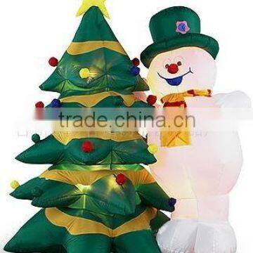 inflatable snowman with tree