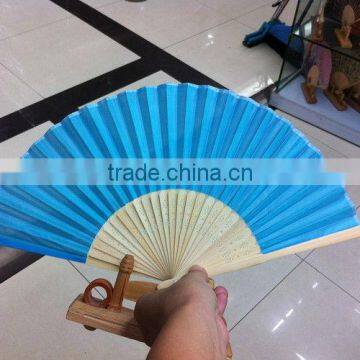 small plastic blue fan