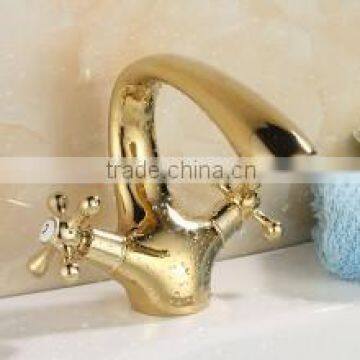 golden color faucet , two spin and two handle vanity basin faucet, hot and cold mixer