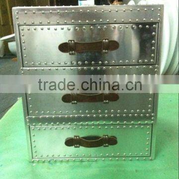 Wooden chest of drawers covered with aluminium