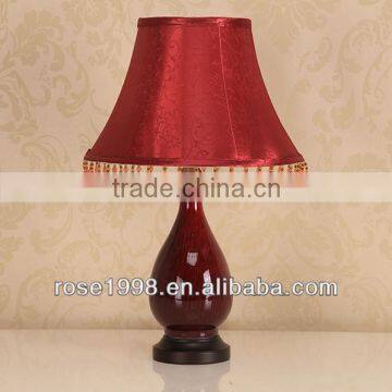 table lamp with ceramic and red lampshade