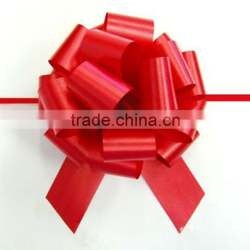 Solid embossed hot red ribbon pull bow for decorative present or gift packing