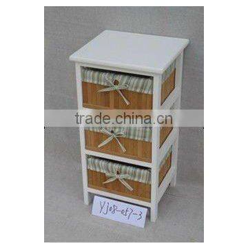 white wooden storage cabinet and wicker drawers