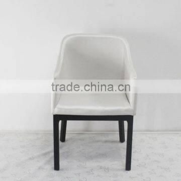 White leather dining chair with wood legs