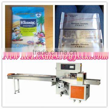 Antiseptic towelette flow packaging machine