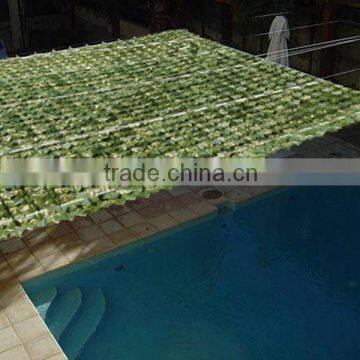 Artificial plastic ivy for swimming pool shading