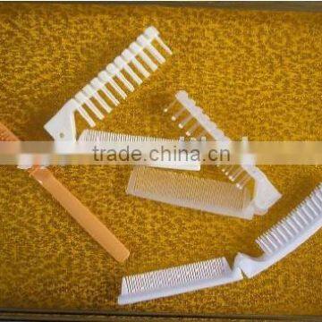 Folding plastic travel combs