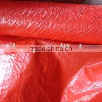 red tarpaulin in roll