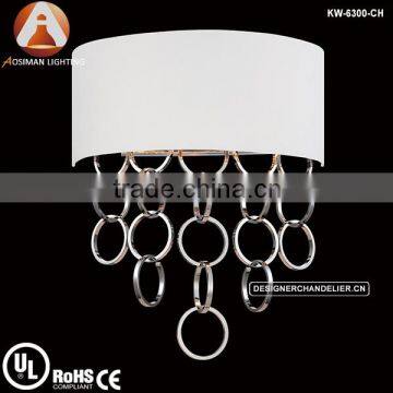 Chrome Novello wall light with white shade glimmering rings