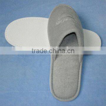 Grey terry towel hotel slipper with 1 color embroidered logo