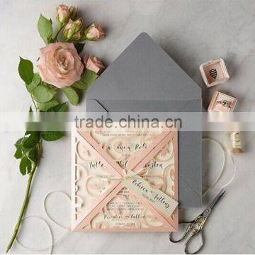 Hot sale artistic pink laser cut wedding invitations with pink ribbons & gray envelopes                        
                                                Quality Choice