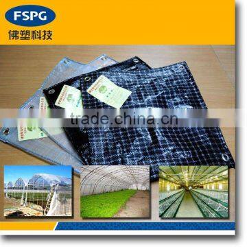 Laminated plastic woven greenhouse fabric