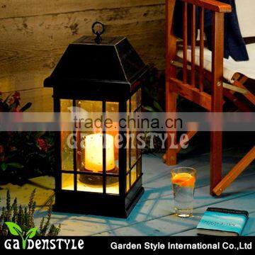 Pillar candle inside San Rafael Mission Style Solar Lantern outdoor led lights