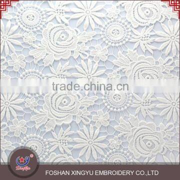 OEM/ODM Manufactur simple and elegant embroidered fabric with cutwork embroidery for wedding dress