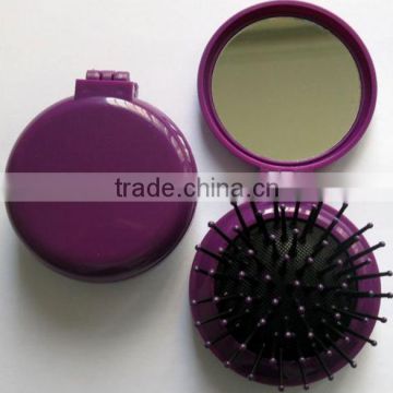 folding travel mirror with comb