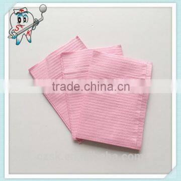 pink disposable dental patient bibs