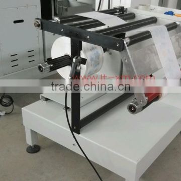 Automatic rewinding machine for non-woven fabric