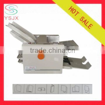 Friction feeding printing paper folding machine