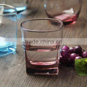 Fancy drinking water glass with thick colored bottom