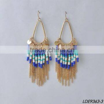 gold disc with colorful bead and gold tassel earrings