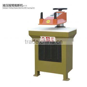 Hydraulic swing arm leather cutting machine