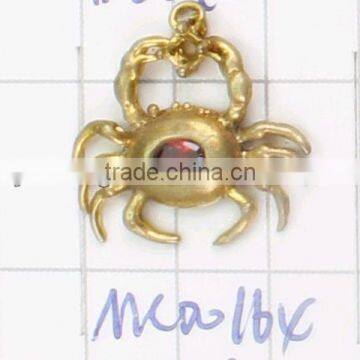 copper Spider shaped pendant with red zircon