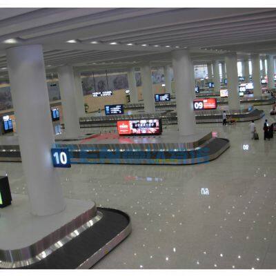 Airport baggage handling system carousel conveyor