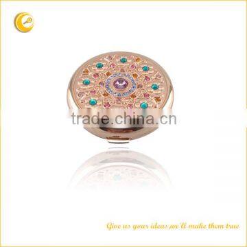 Pocket mirror with stone rose gold finishing