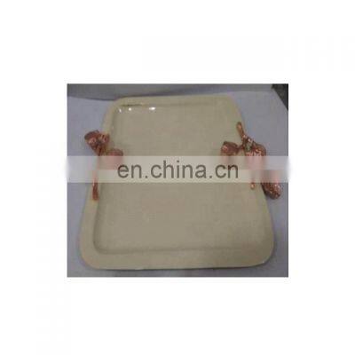 white enamel tray with metal copper handle