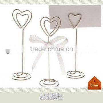 Wrought iron heart business card holder on table