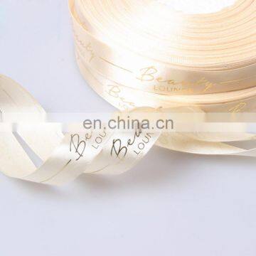White Polyester ribbon with gold logo