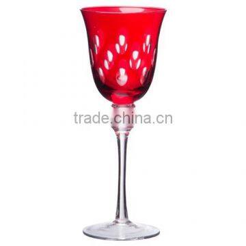 White wine glass with red spraying and hand cutting.