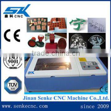 Fashion cotton fabric laser cutting textile machine leather craft /1400*1000mm knitted woven jeans laser cutting machine