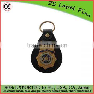 metal gold badge with leather keychain holder