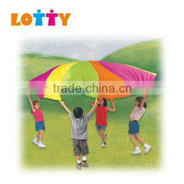 Colourful kids play parachute