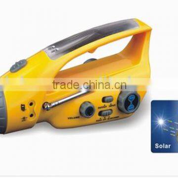 Solar/crank dynamo torch with FM radio