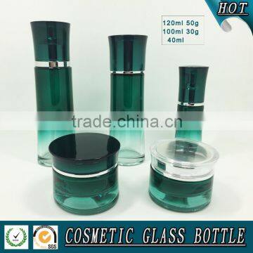 Green coloured cosmetic glass bottle and cosmetic glass jar