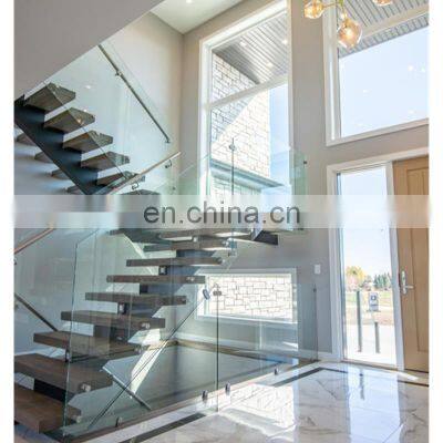 U shape staircase design with glass railing handrail