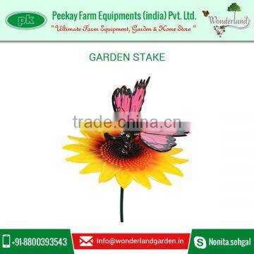 Metal Flowers and Garden Stakes with Decorative Metal Garden Butterfly Sitting