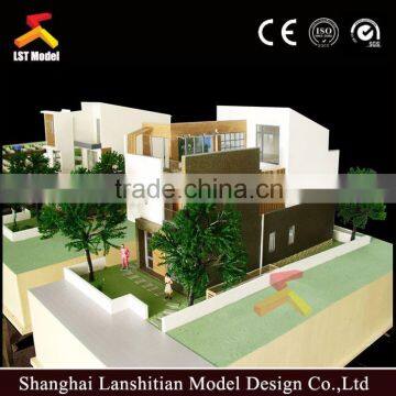 Real estate wooden house model with lighting system display