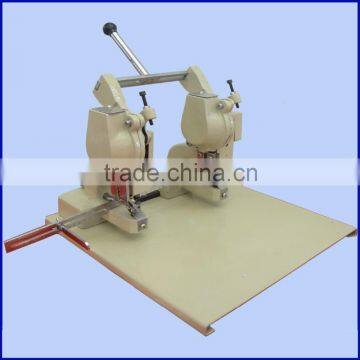 Double head eyelet machine